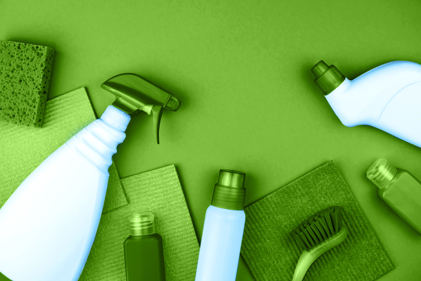 House cleaning products are on green background.